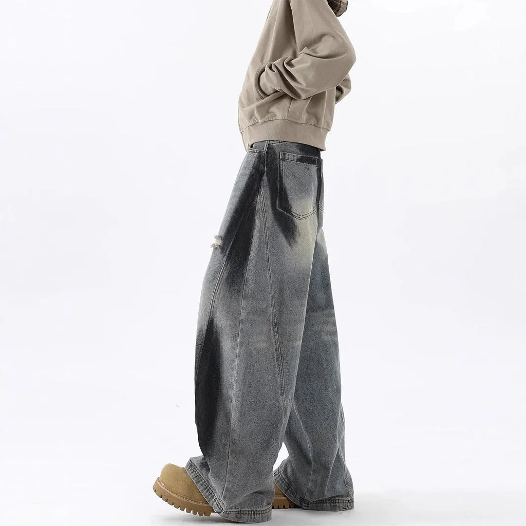 Men's blue loose fit ripped jeans with American-style splash-ink wash and distressed detailing