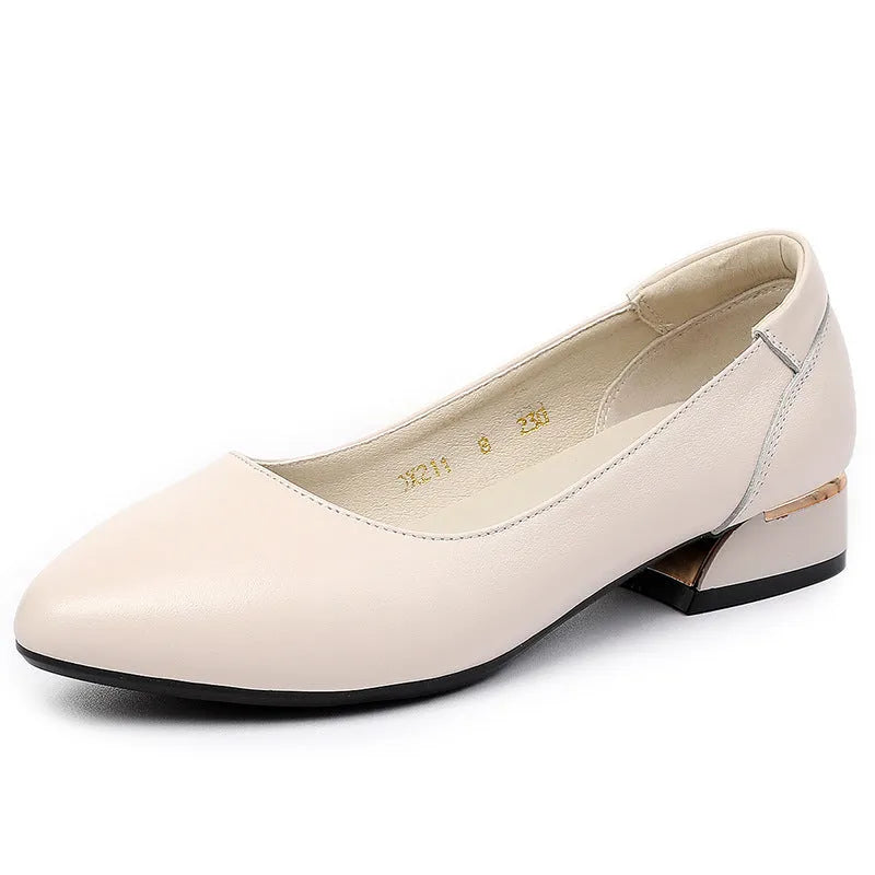 Beige pointed-toe casual shoes with a buckle fastening and flat rubber sole.