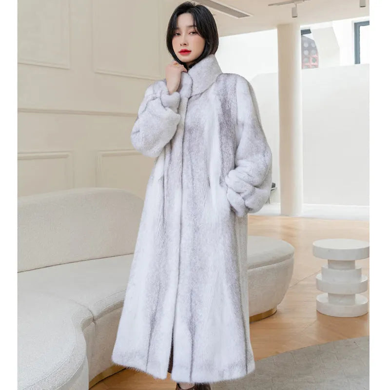 White women's faux fur coat with a stand-up collar, shown full-length.