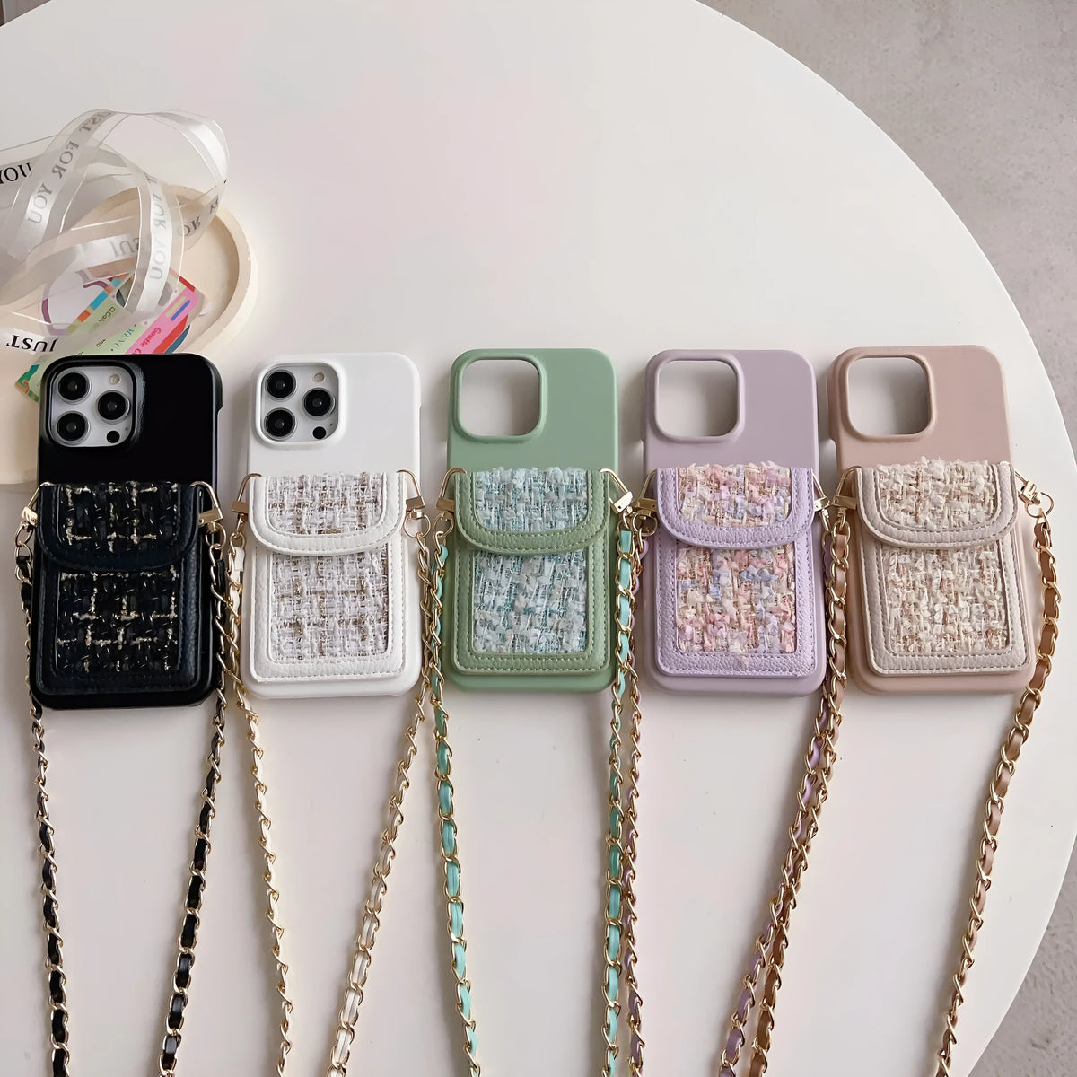 Crossbody chain card holder phone case in PU leather with frosted finish, shown in black, green, purple, white