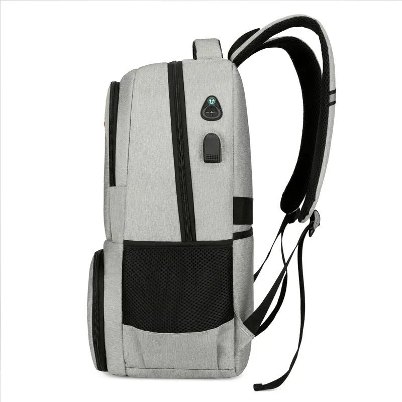 Light grey Oxford cloth backpack with curved shoulder straps showing sewing line details and dry-wet separation compartments