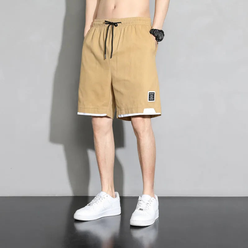 Cotton shorts for boys in black, khaki, or white with mid-waist design and shorts length