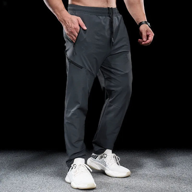 Men's waterproof quick-dry nylon workout trousers in multiple colours for sports and fitness activities