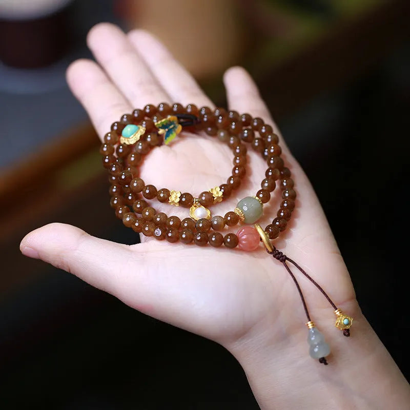 Brown Hetian jade three-ring bracelet with geometric design, butterfly motifs and silver accessories
