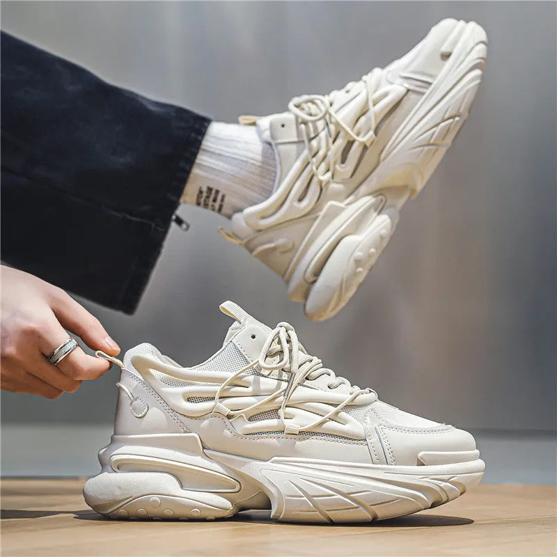 Men's low-top sneakers in beige with mesh and PU leather upper and rubber sole on a plain background