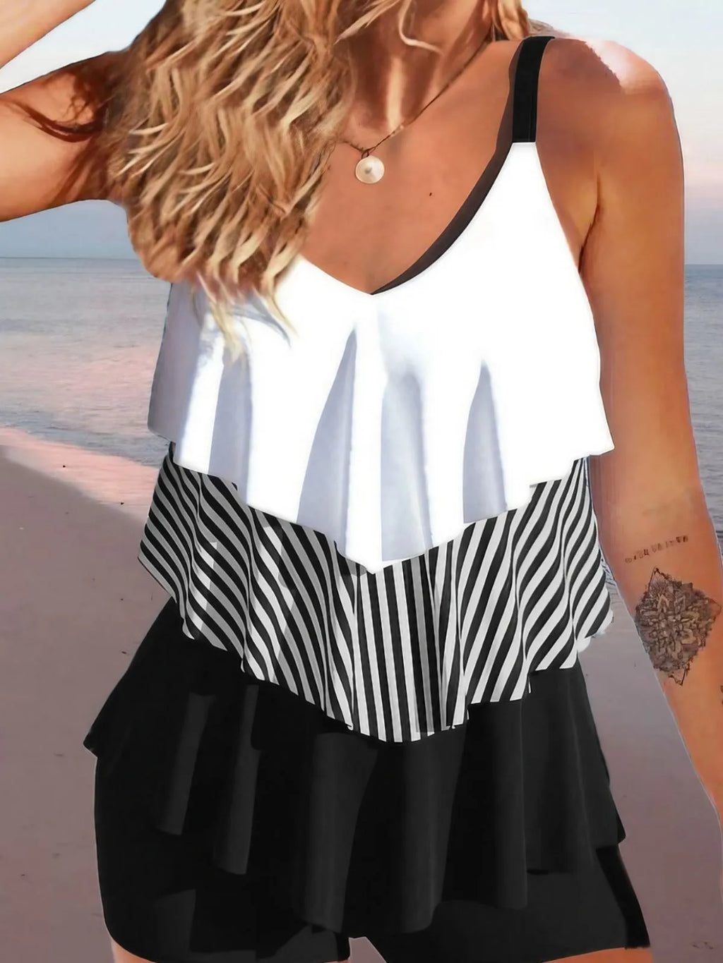 Women's backless spaghetti-strap ruffle bikini swimsuit top and shorts in a floral pattern.