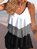 Women's backless spaghetti-strap ruffle bikini swimsuit top and shorts in a floral pattern.