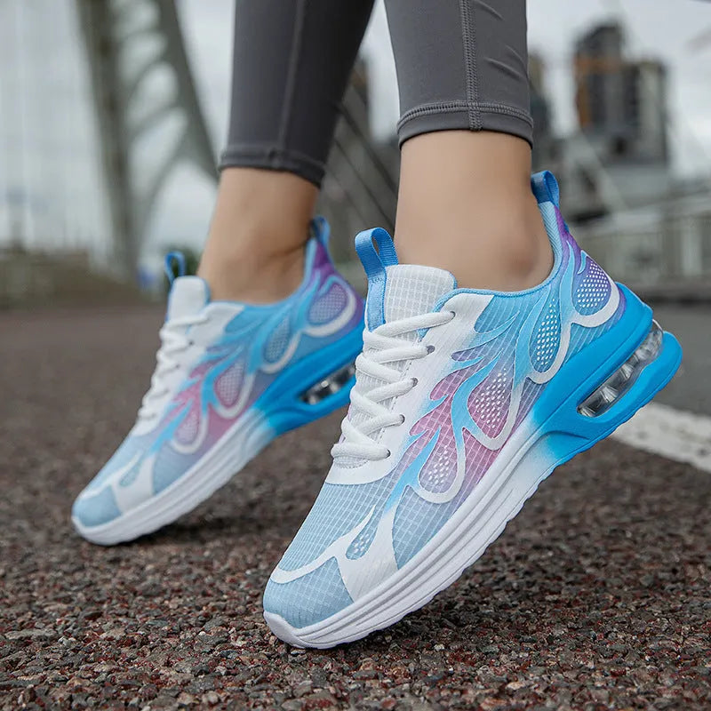 Women's pink mesh casual sneaker with lace-up front and light-coloured PU sole.