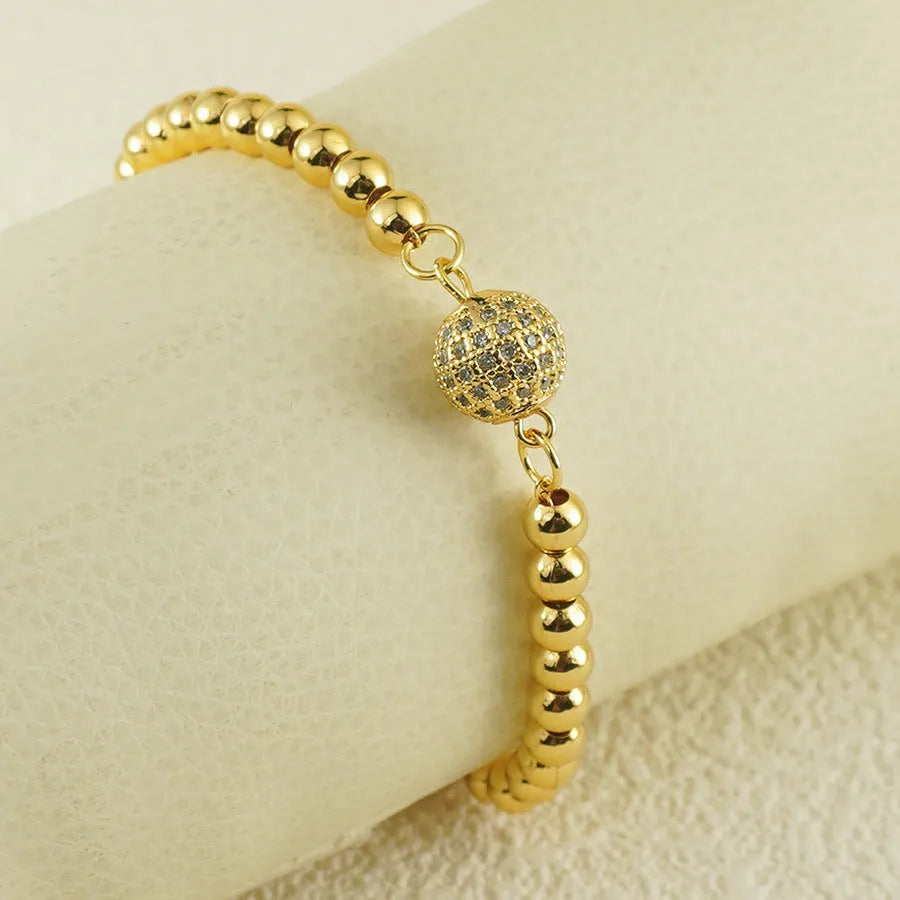 Women's copper bracelet with heart shape and round zircon stones in Arabic design style