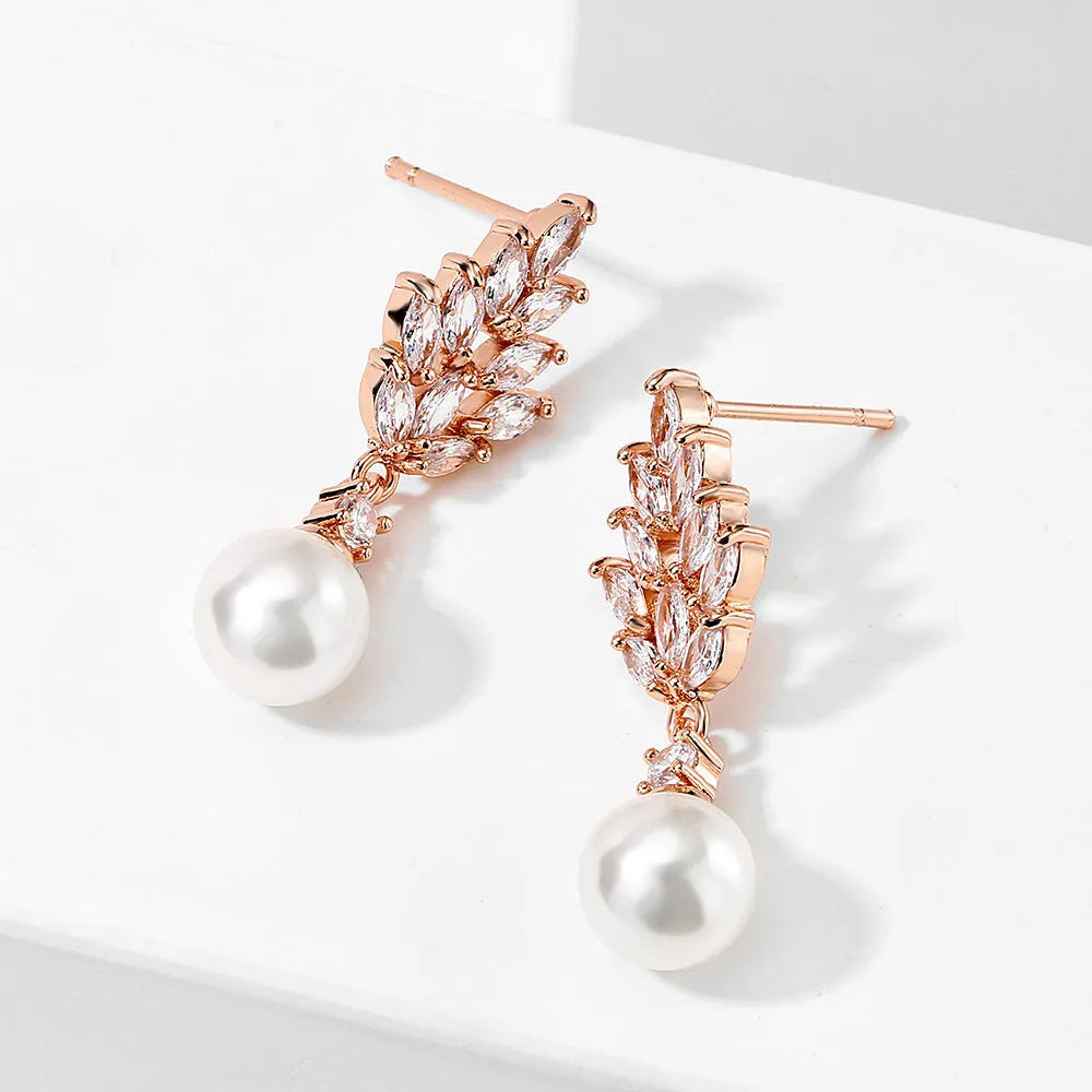 Geometric flower earrings with micro inlaid zircon stones on copper base, plated in gold, platinum, or rose gold.