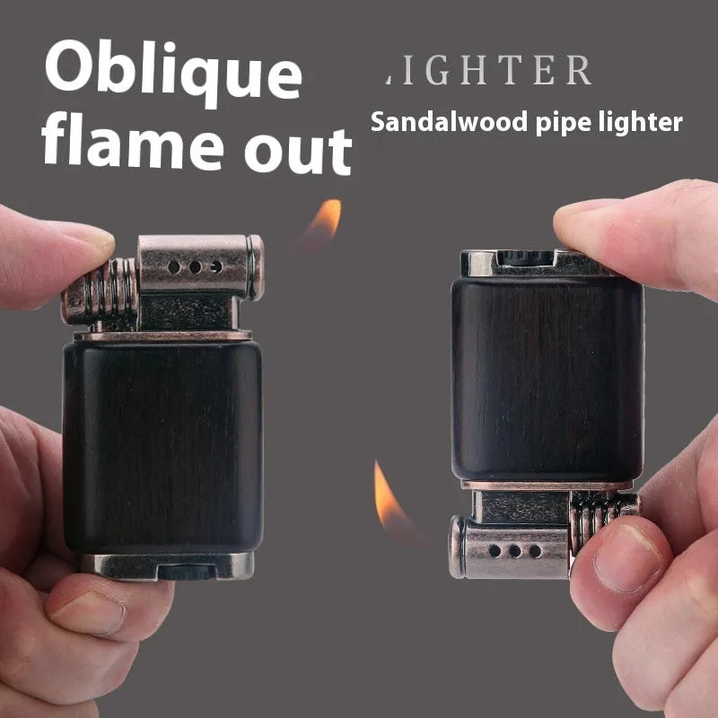 Ebony gas lighter with black wood body and rosewood decorative accents including sun surface and good luck designs