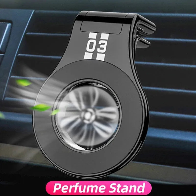 Magnetic car phone holder mounted on air vent with phone attached, showing 360-degree rotation and fragrance slices