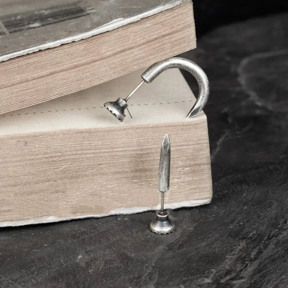 S925 sterling silver nail earrings with ear hook, showing straight and curved nail designs in punk style