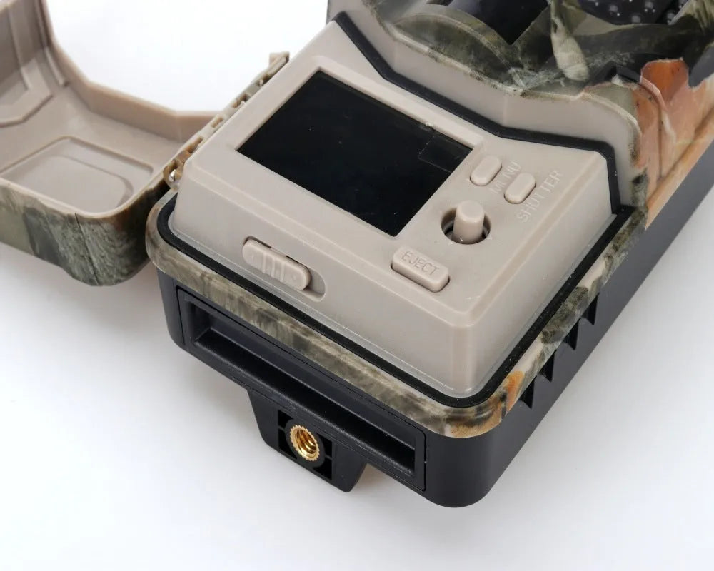 Compact camouflage infrared hunting camera with Bluetooth for mobile APP connectivity.