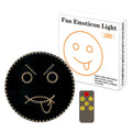 Black car rear window LED expression light showing smiley face pattern with orange illumination