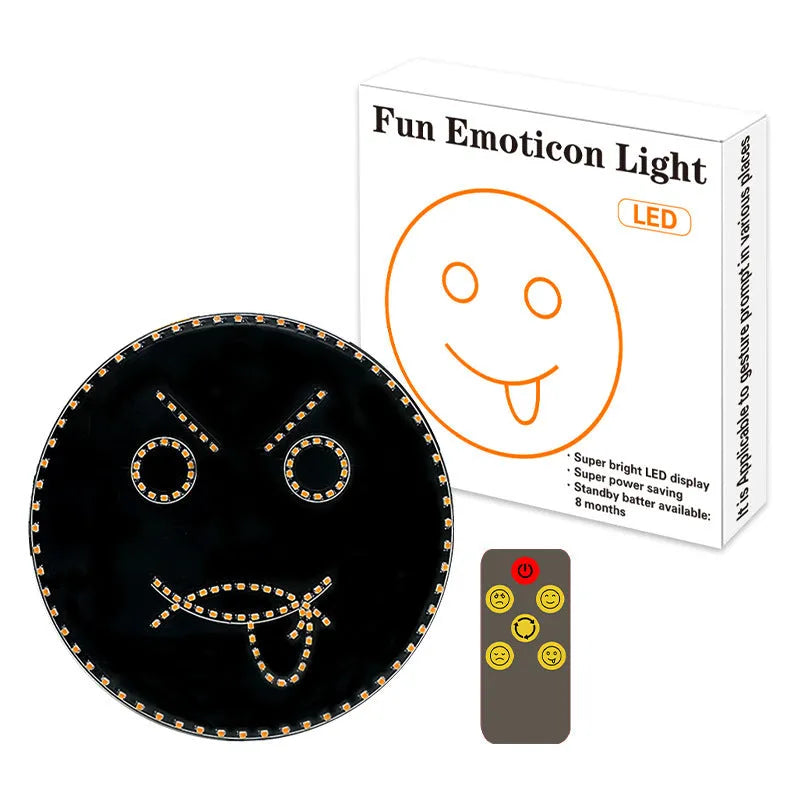 Black car rear window LED expression light showing smiley face pattern with orange illumination