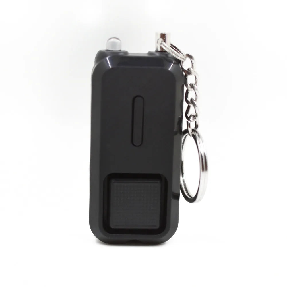 ZQ-202 personal safety alarm in pink, showing compact size of 65mm by 30mm.