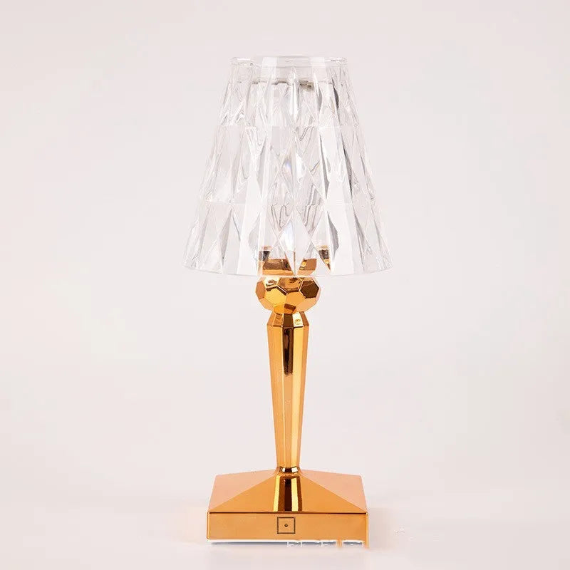 Portable touch projection night light with rose gold plating and acrylic construction, showing compact design for bedroom or bar use