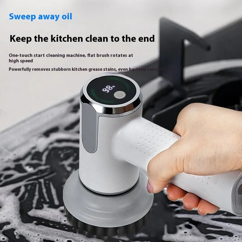 White wireless electric cleaning brush with display, Type-C port, and interchangeable brush heads on a kitchen sink