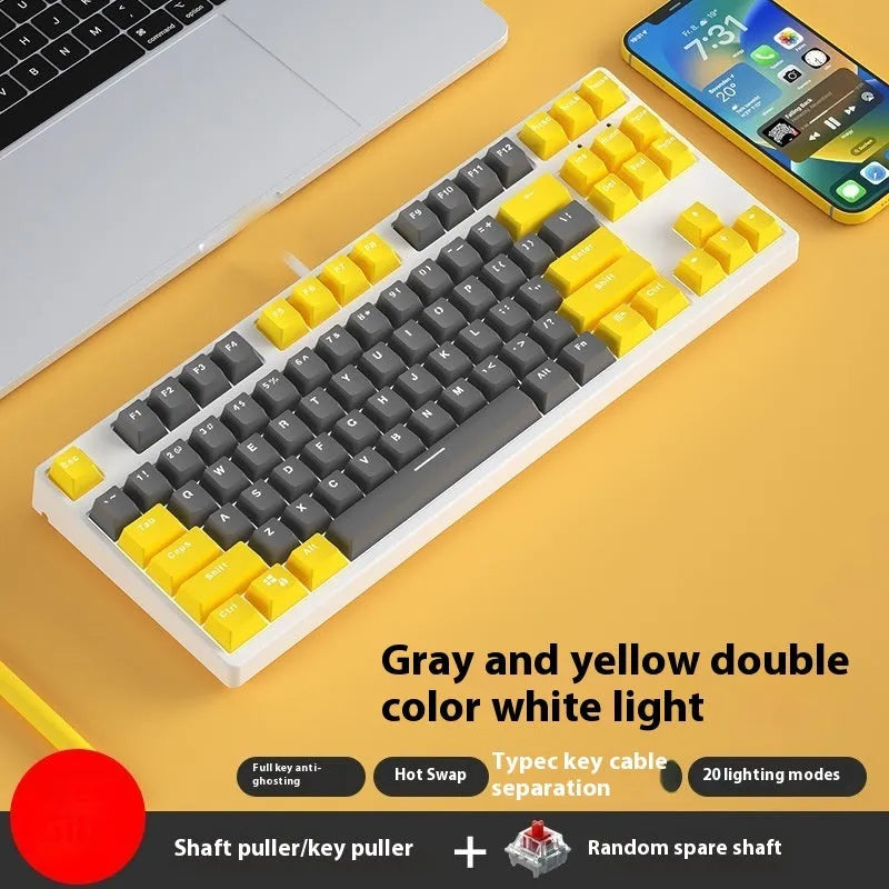 87-key wired mechanical keyboard with two-tone keycaps and metal frame, showing compact design and included tools