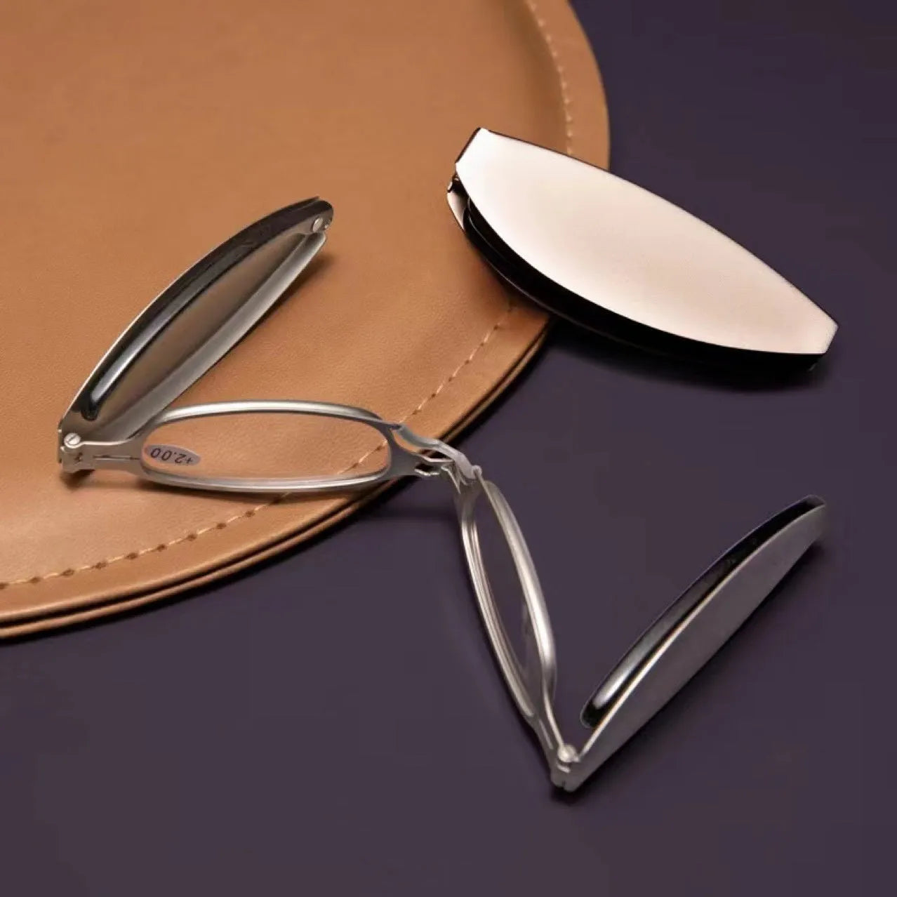 Folding pocket presbyopic glasses in retro style with ring elements, shown both open and folded to 12cm length