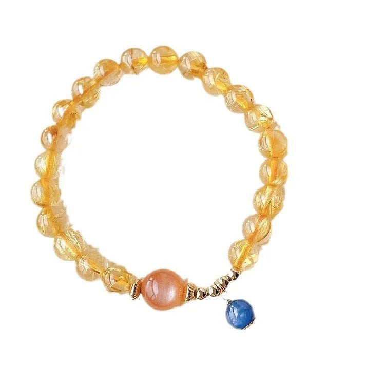 Women's gold rutilated quartz and sunstone crystal bracelet with round beads on elasticated band