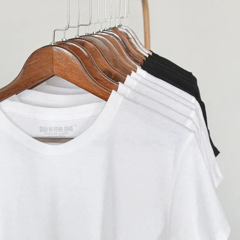 Men's solid colour combed cotton round neck T-shirt on a hanger.