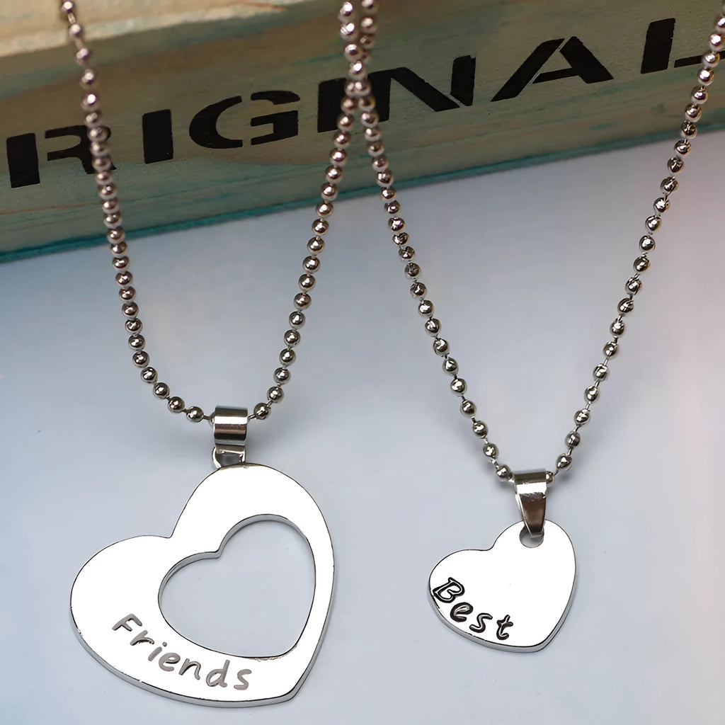 Two-piece silver alloy necklace set with heart-shaped pendants and cross chains in a love design