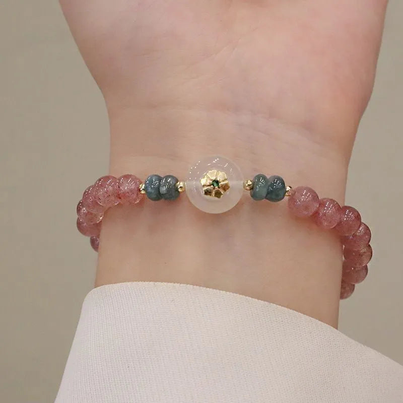 Women's strawberry quartz bracelet with blue water emerald pendant and peace buckle clasp
