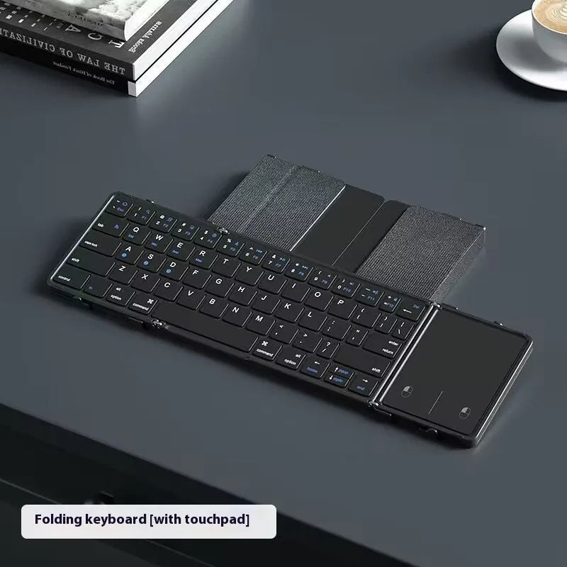 Black folding Bluetooth keyboard for tablets showing touchpad variant with compact folded dimensions