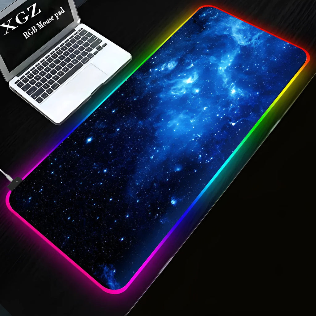 Symphony RGB luminous mouse pad with starry sky pattern lit by USB-powered LEDs on a desk.