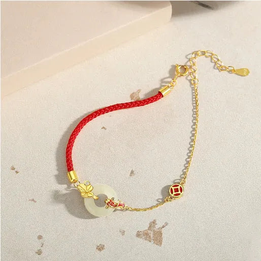 Gold electroplated 925 silver women's bracelet with koi and peace buckle design on adjustable red rope