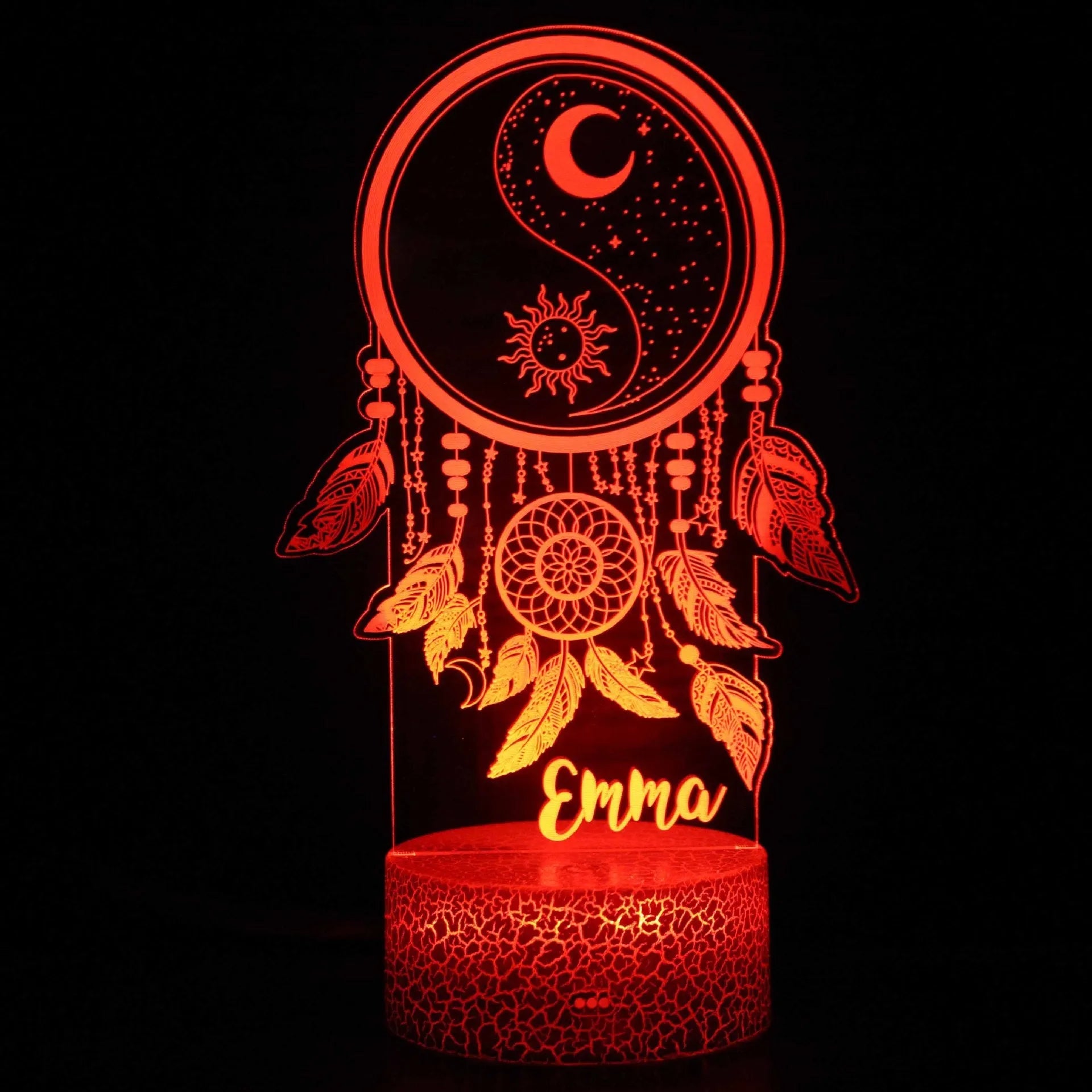 Cartoon-style 3D LED night light with black touch base and remote control on a bedside table.