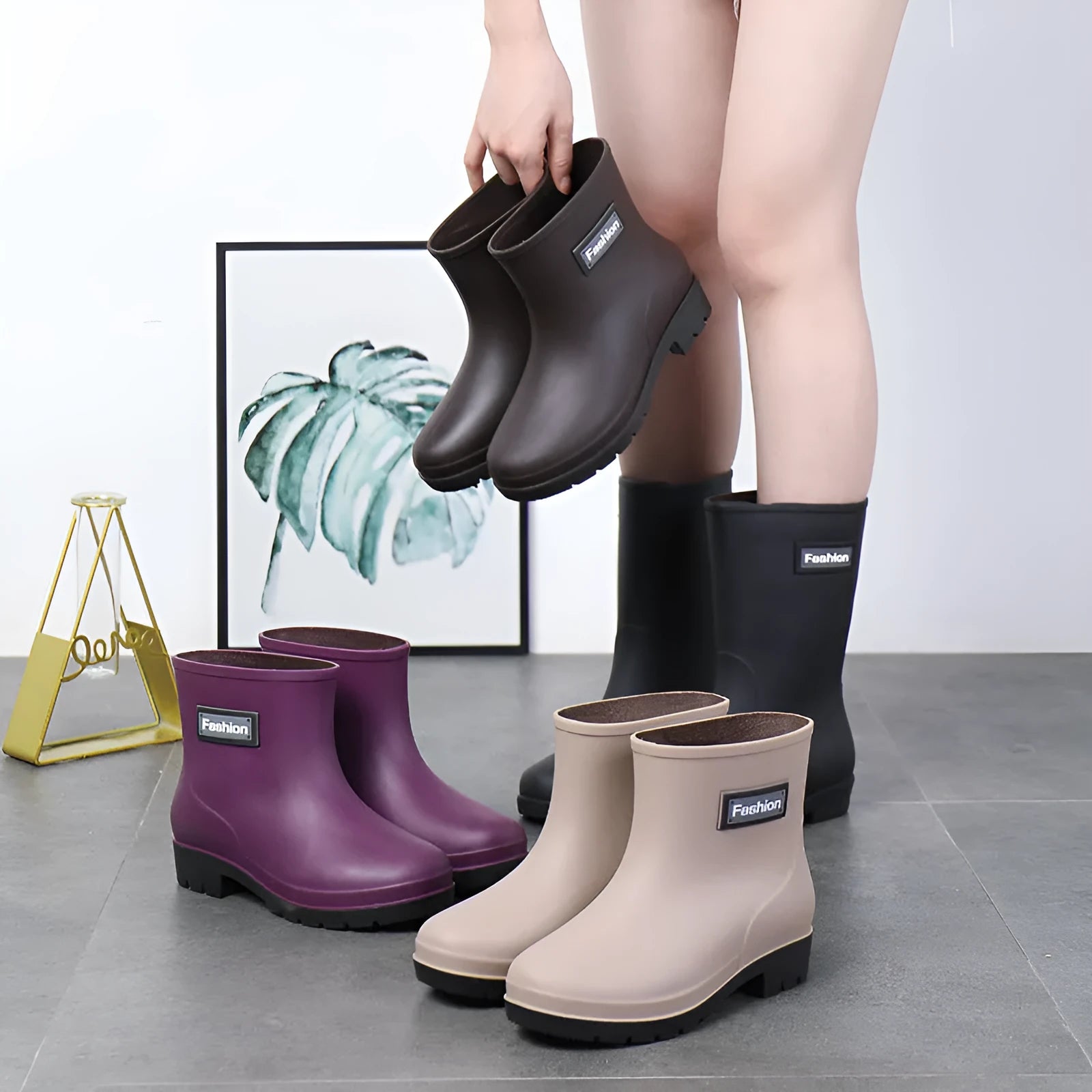 Women's PVC mid-calf rain boots in black, brown, apricot, and purple colours