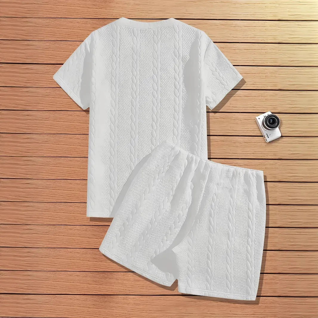 Men's black polyester sports two-piece set with rib short sleeves and a patch design detail.