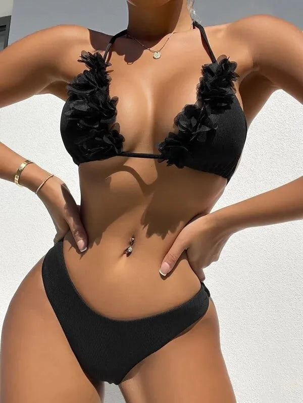 Black women's two-piece bikini set with a gathered swim top and matching shorts.