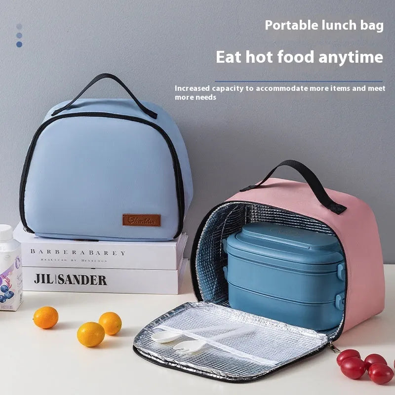 Insulated lunch box bag in sapphire blue with textured cloth exterior and secure closure
