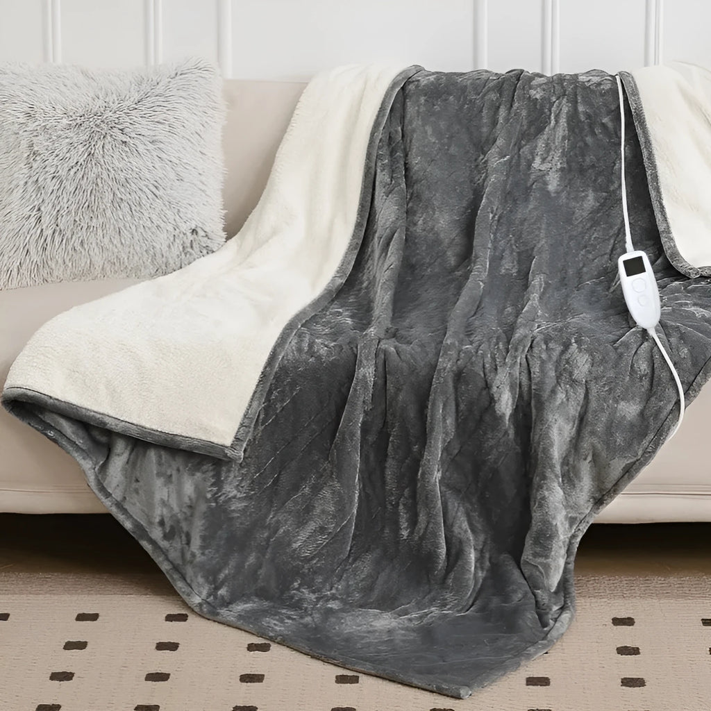 Light grey cotton electric heating blanket shown in a folded position, with adjustable temperature control for use as a blanket or hot compress pad.