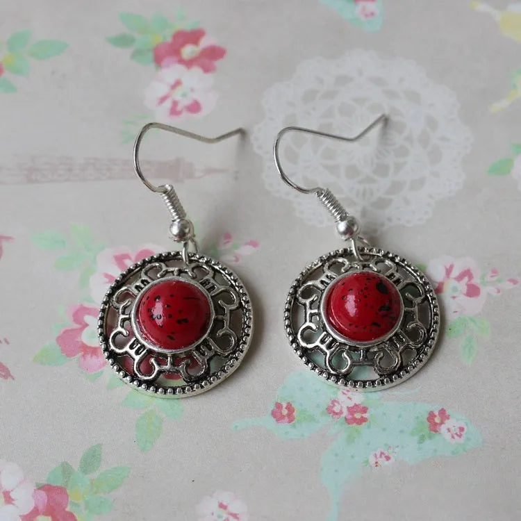 Handmade Miao silver turquoise geometric earrings with flower disk shape and totem patterns