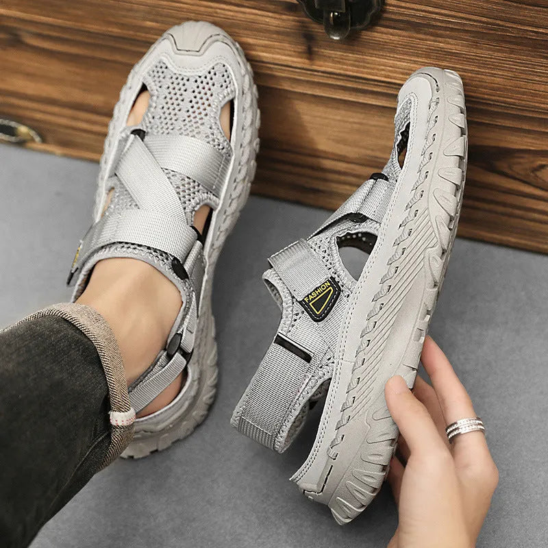 Men's casual sandals with hollow mesh surface and genuine leather upper in grey colour