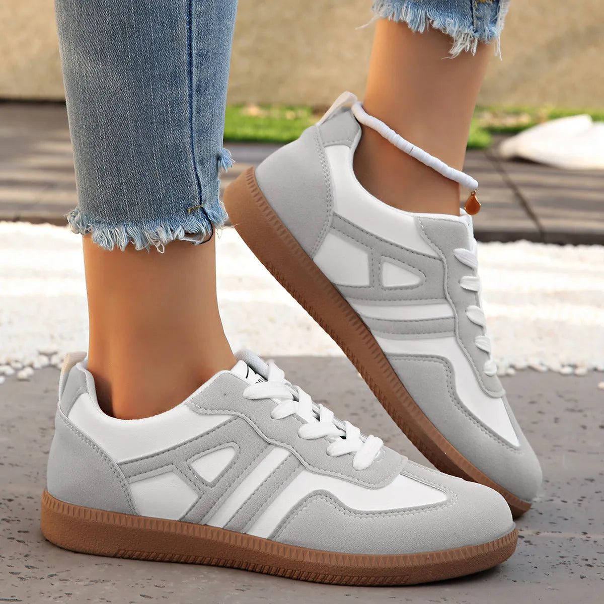 Women's retro colour matching lace-up casual trainers with a low platform heel in black, grey, or khaki.