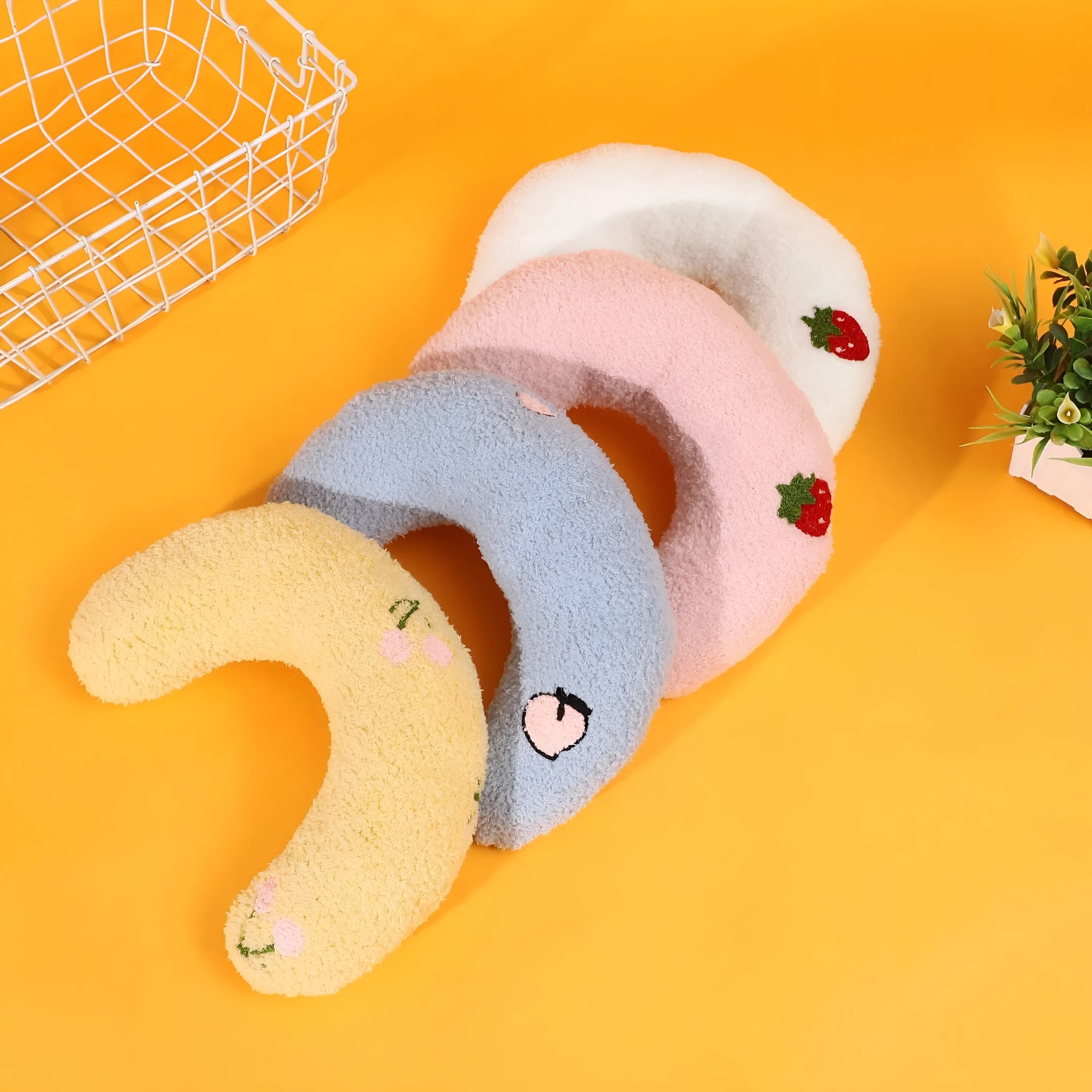 Cartoon patterned U-shaped half moon pillow for pets in blue, pink, white or yellow colours
