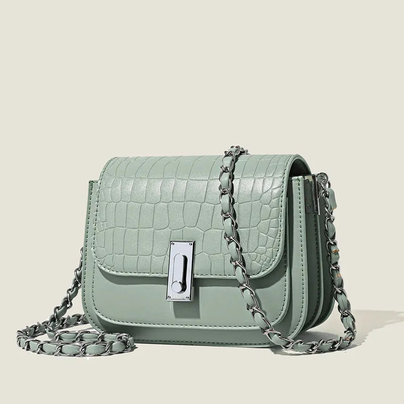 Women's black chain shoulder bag with cross-body strap and internal phone pocket, horizontal square shape