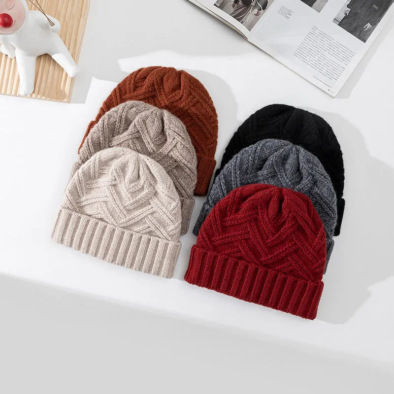 Wool knitted hat with dome crown in totem pattern, shown in ankela red colour