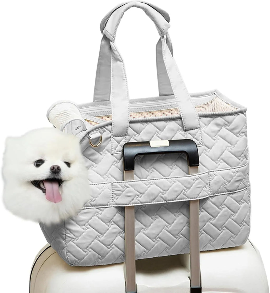 Grey pet carrier handbag with mesh panels showing cat inside, multiple pockets visible on exterior