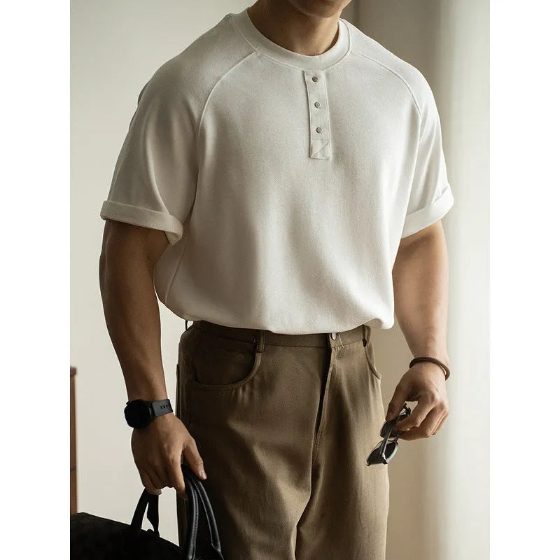 Casual pullover top with raglan sleeves in terry texture fabric showing loose fit and colour options