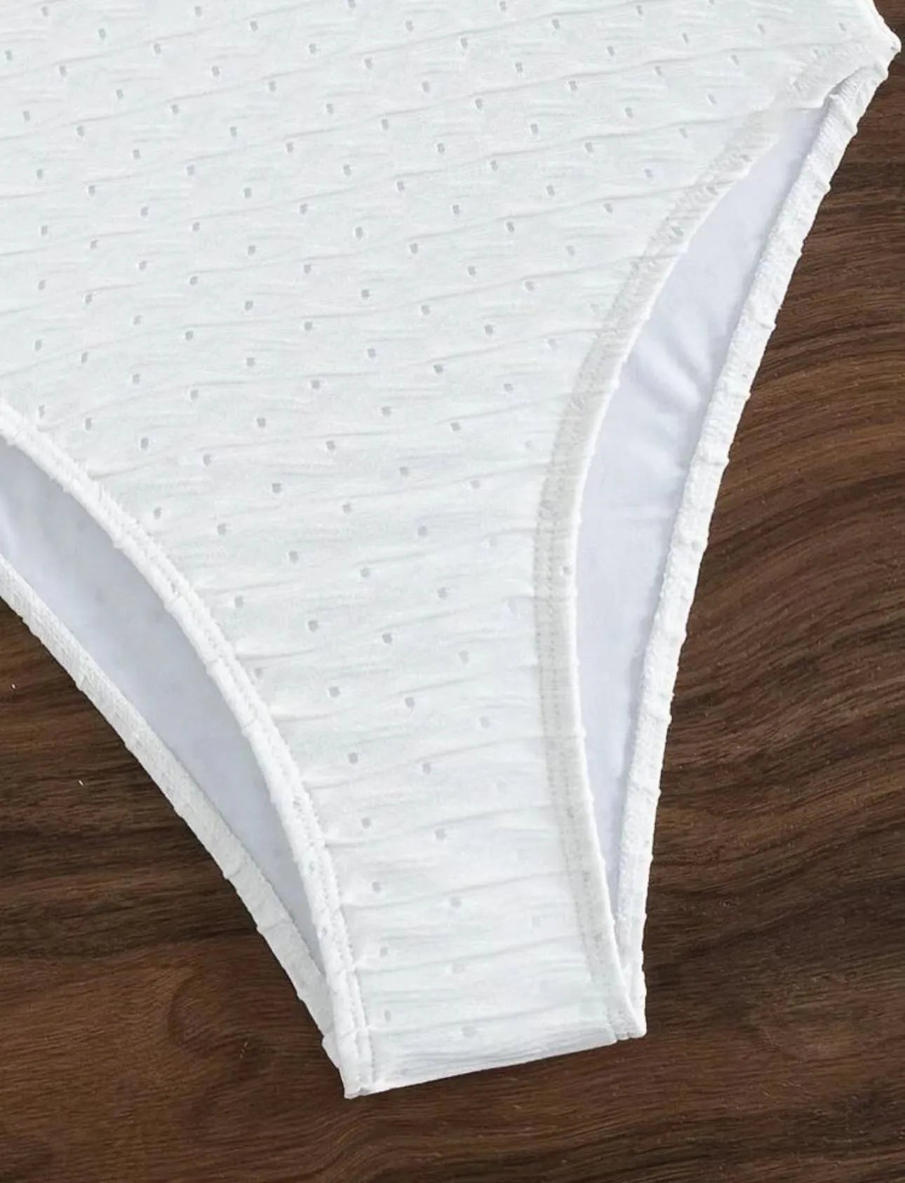 White women's one-piece swimsuit with sling style design