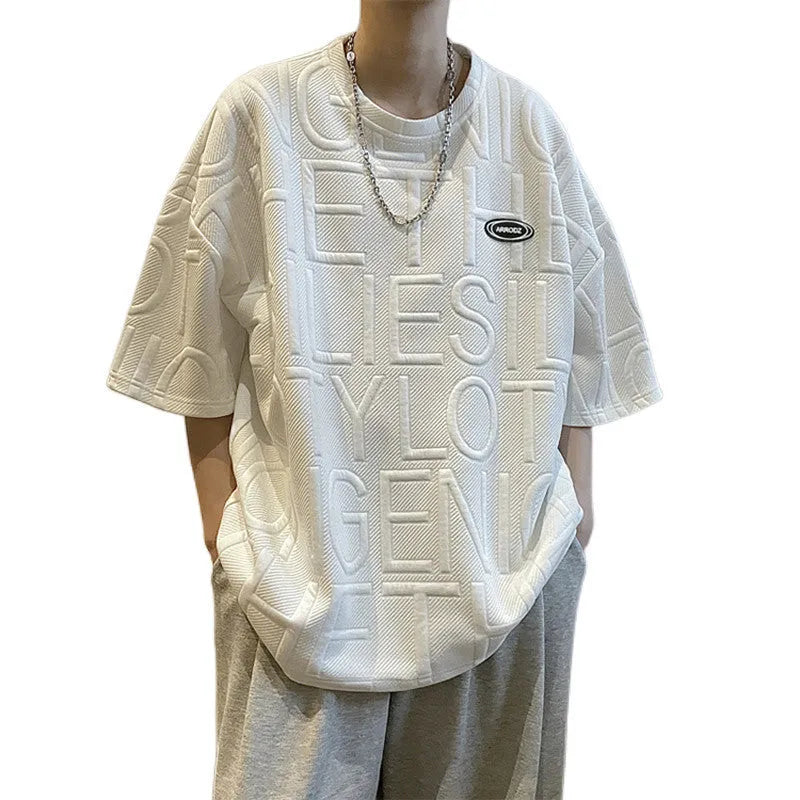 Men's grey T-shirt with raised black letters, loose fit, short sleeves, on a hanger