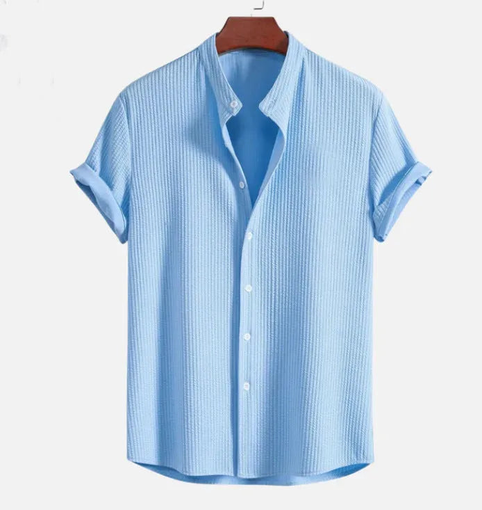 Men's loose fit short sleeve shirt in polyester fibre, available in nine colours including wine red and navy blue