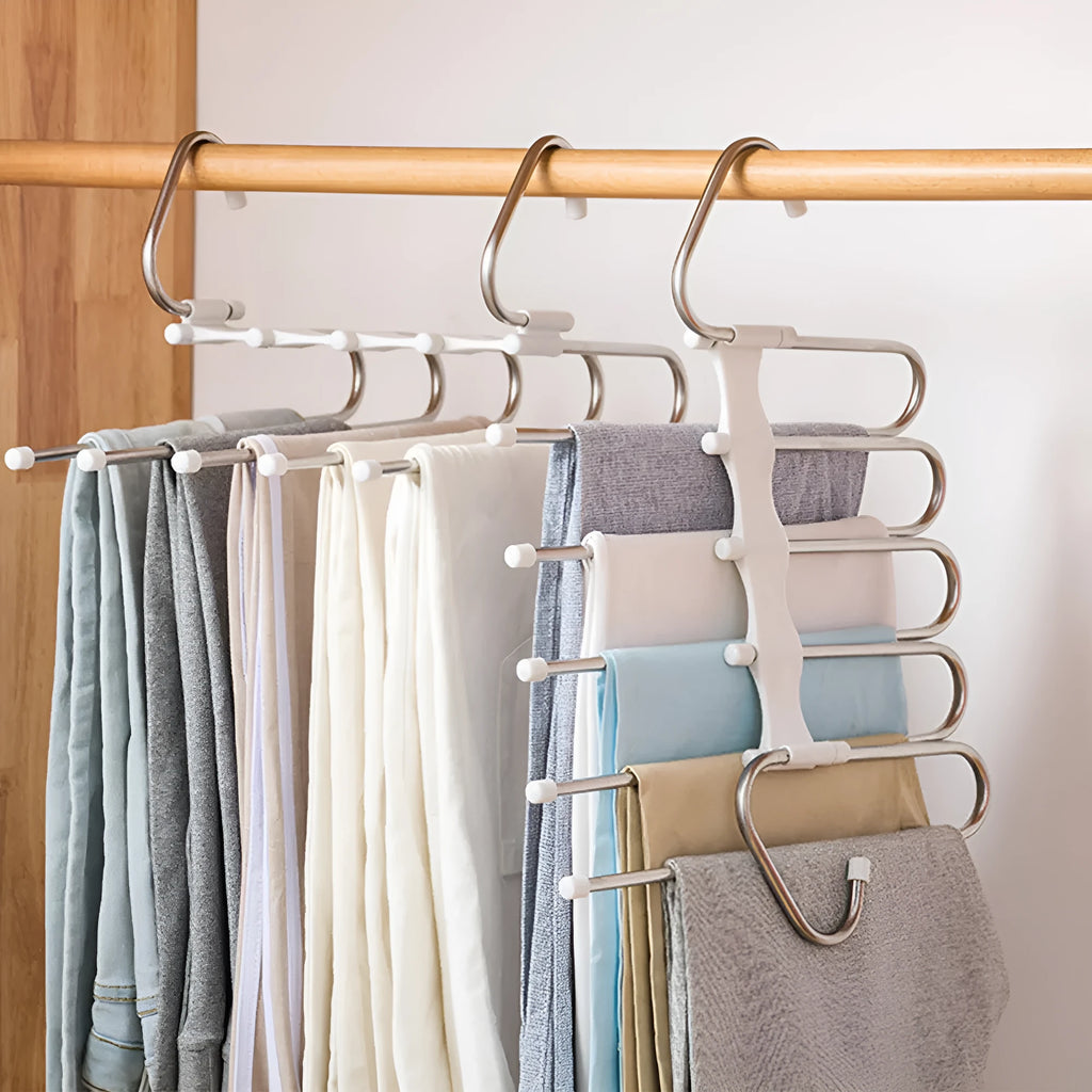 Black stainless steel 5-in-1 multi-functional trousers hanger with five booms on a clothes rack